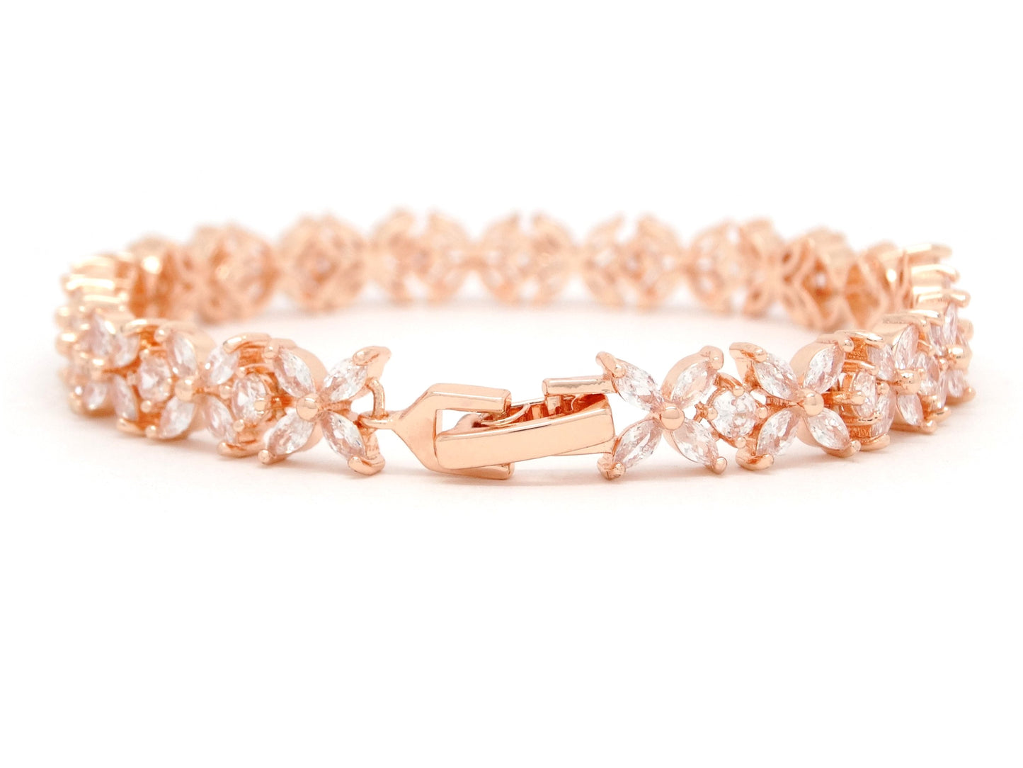 Rose gold bracelet with floral design on a white background