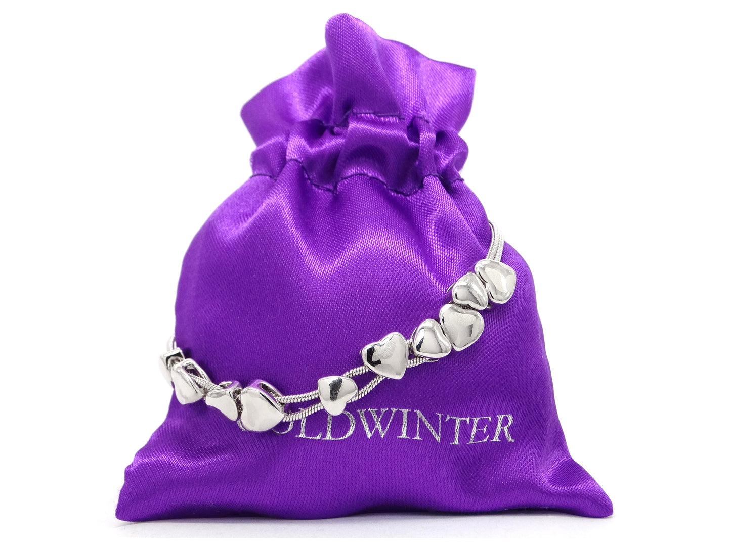 Silver bracelet on a purple drawstring bag with 'Goldwinter' branding.