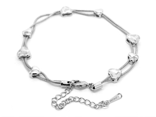 Silver bracelet with heart-shaped charms on a white background