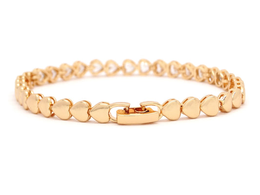 Gold bracelet with heart-shaped white gemstones on a white background