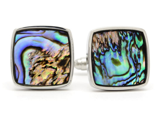 Pair of square cufflinks with multicolored abalone shell design on a white background