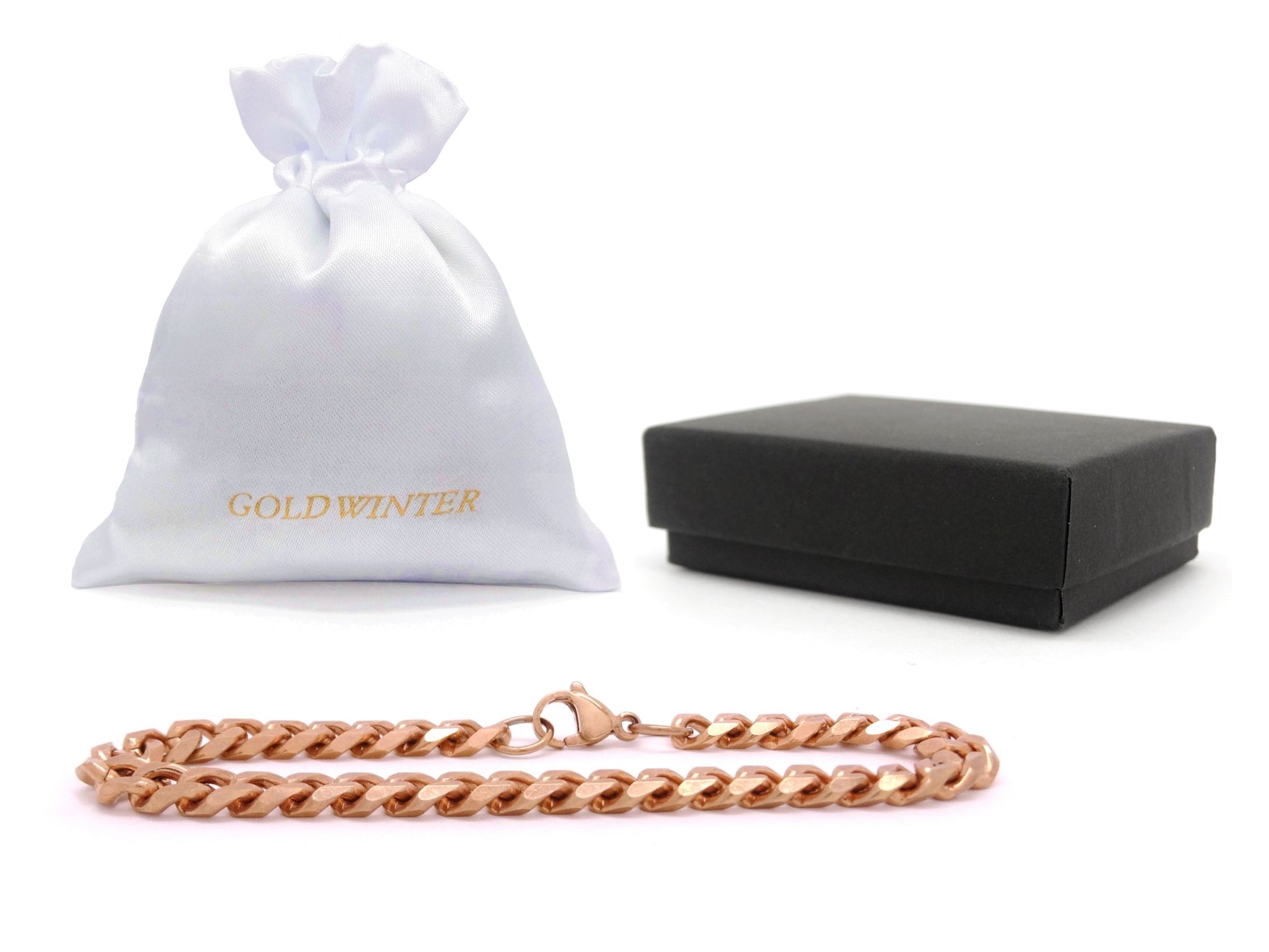 Rose gold chain necklace with a white drawstring bag and black box on a white background