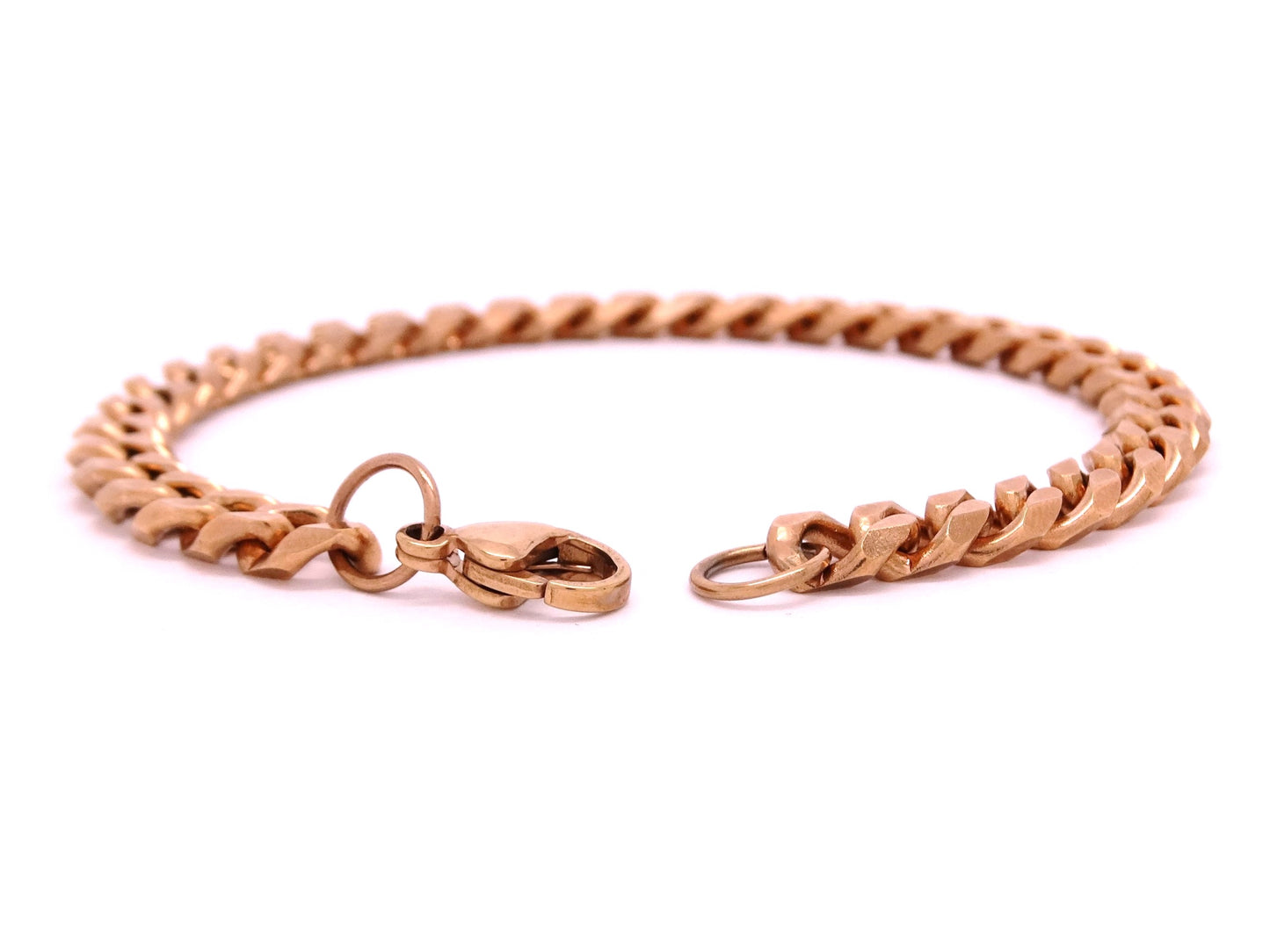 Rose gold chain bracelet on a white background