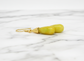 Yellow stone earring with gold hook on a white background