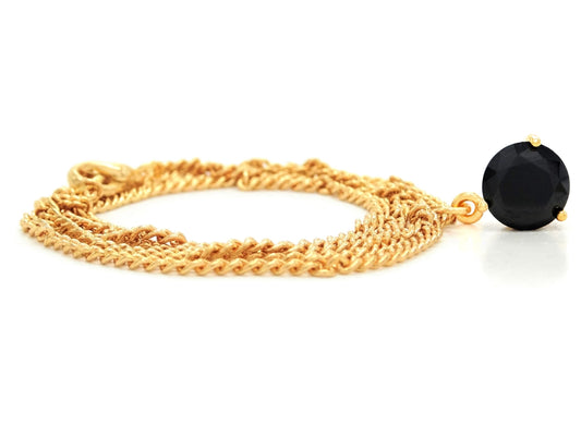 Yellow gold black round gem necklace and earrings FRONT